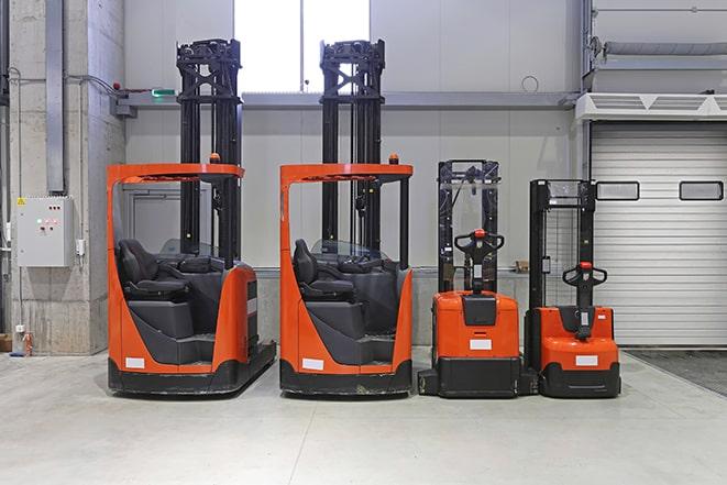 forklifts in a warehouse setting